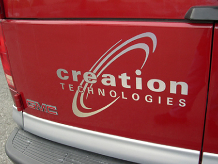 Creation Technologies red truck back